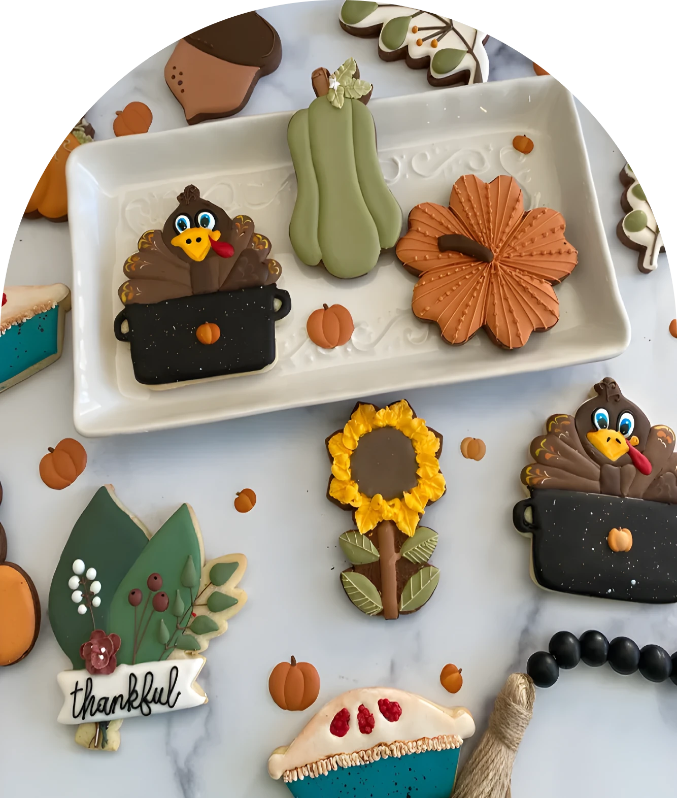 Thanksgiving-themed decorated cookies on a tray
