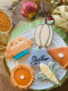 Festive autumn-themed decorated cookies display