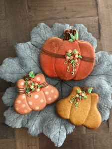 Autumn-themed cookies with leaf backdrop