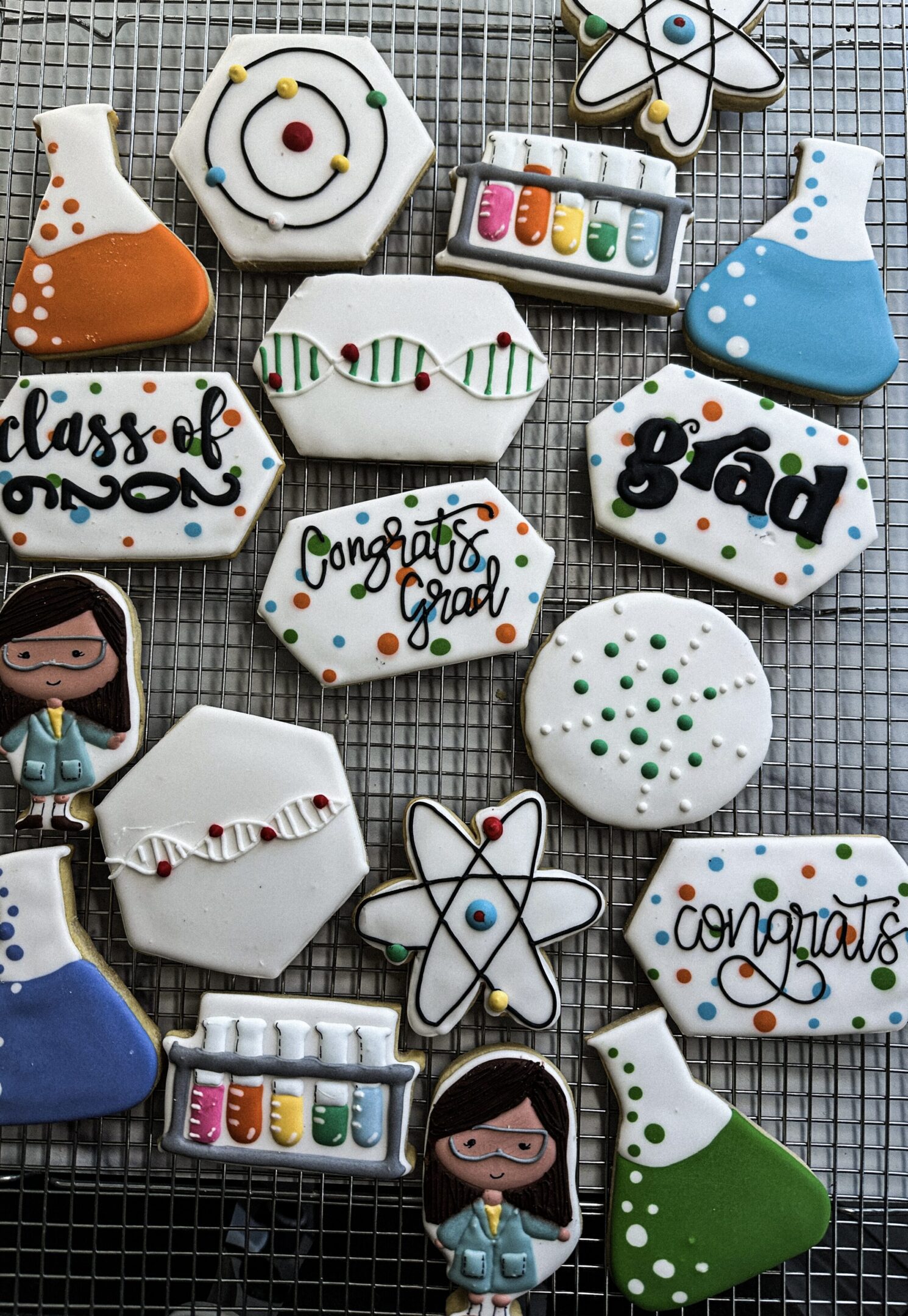Science-themed graduation decorated cookies